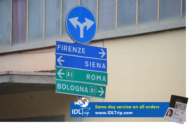 Street signs indicating which way you should go… according to the city located in that direction